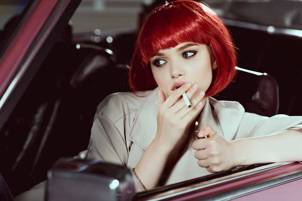 Attractive Girl Red Wig Smoking Cigarette Looking Away While Sitting — Stock Photo, Image