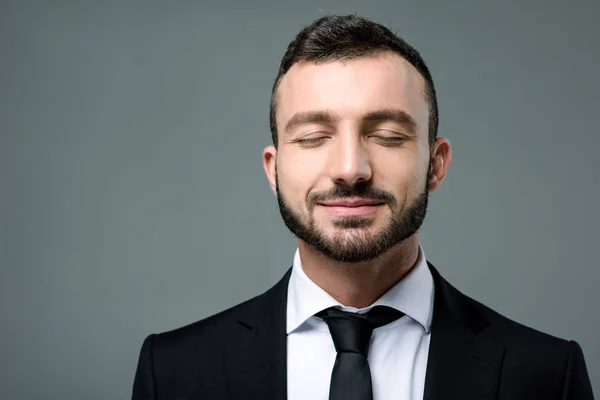 Handsome Smiling Businessman Closed Eyes Isolated Grey — Stock Photo, Image