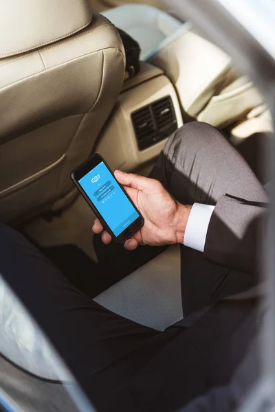 Cropped Image Businessman Holding Smartphone Loaded Skype Page Car — Stock Photo, Image