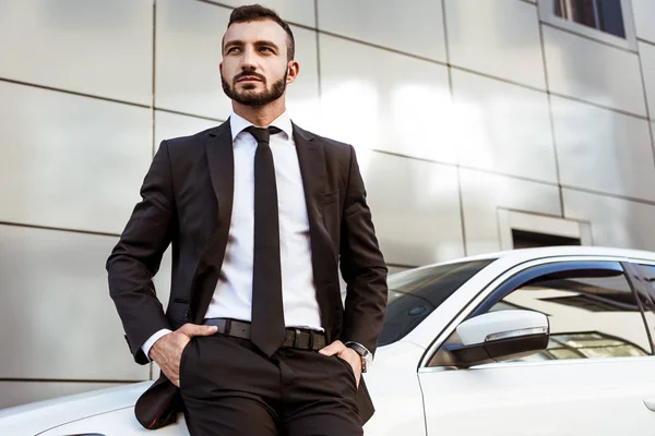 Handsome Businessman Leaning Car Looking Away — Stock Photo, Image