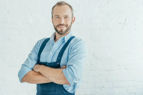 Smiling Bearded Worker Overalls Posing Crossed Arms — Stock Photo, Image