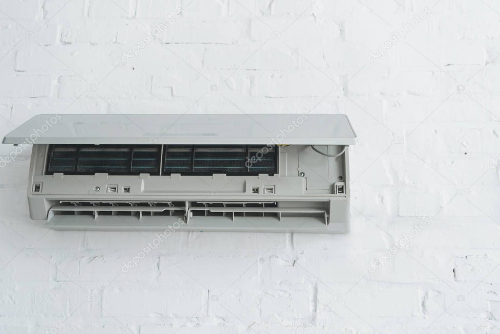 opened air conditioner on white wall at home