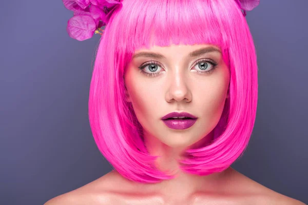 Close-up portrait of attractive young woman with pink bob cut and flowers in hair looking at camera isolated on violet — Stock Image Close Portrait Attractive Young Woman Pink Bob Cut Flowers Hair Stock Photo