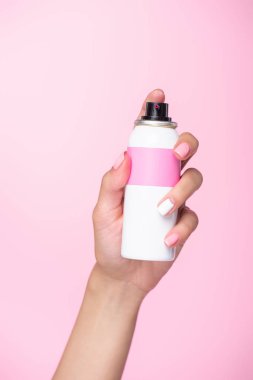cropped shot of woman holding can of spray paint for hair isolated on pink clipart