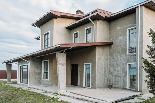 Чи вигідно будувати будинок в Україні depositphotos 204515718 stock photo unfinished concrete building cloudy sky Чи вигідно будувати будинок в Україні