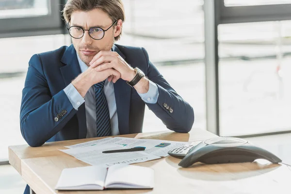 Thoughtful Young Businessman Sitting Workplace Looking Away — Stock Photo, Image