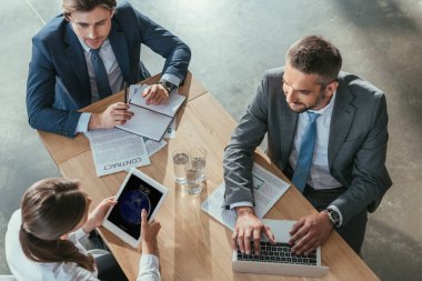 high angle view of successful business people working together at modern office clipart