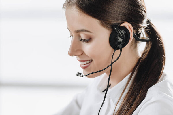 beautiful female call center worker with headphones