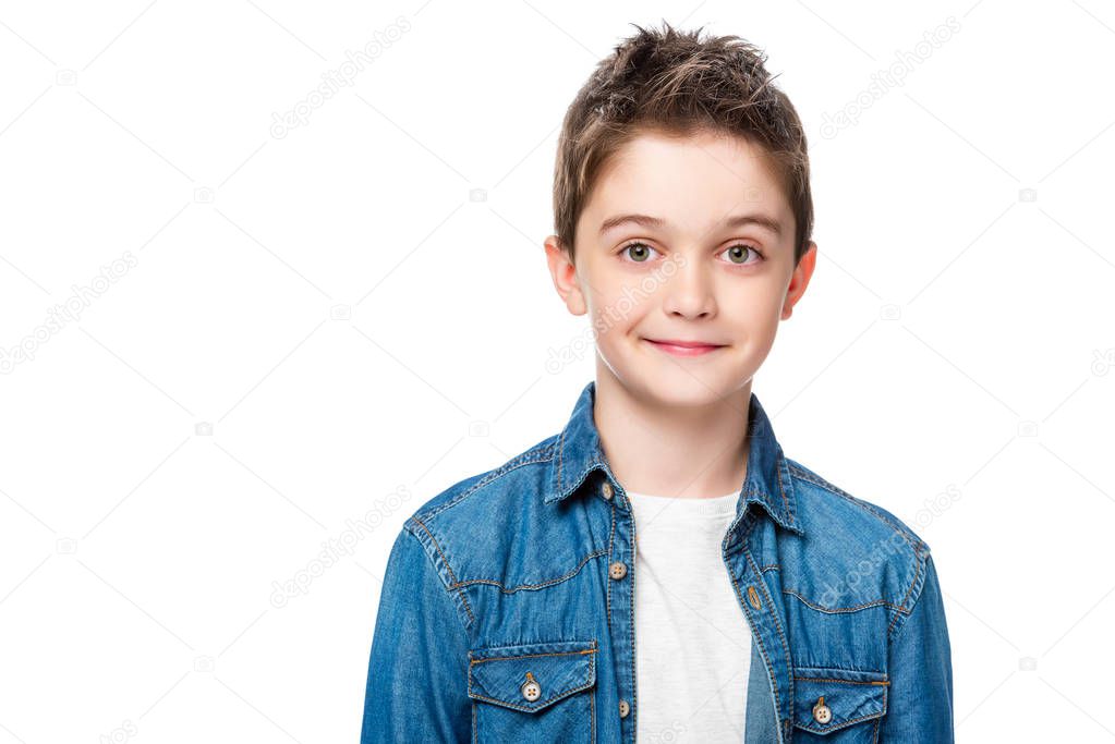 adorable cheerful schoolboy looking at camera isolated on white