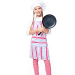 Schoolchild in costume of chef holding frying pan and looking at camera isolated on white