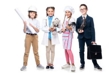happy schoolchildren in costumes of different professions isolated on white clipart