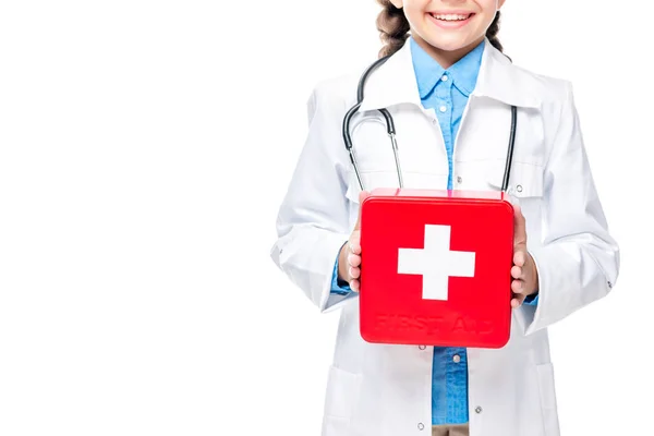 学童在医生服装中的裁剪图像在白色的急救套件 — 图库照片