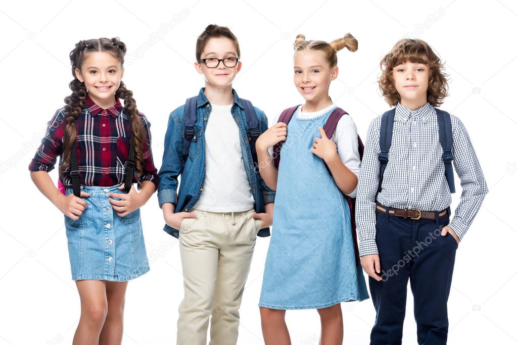 cheerful schoolchildren looking at camera isolated on white
