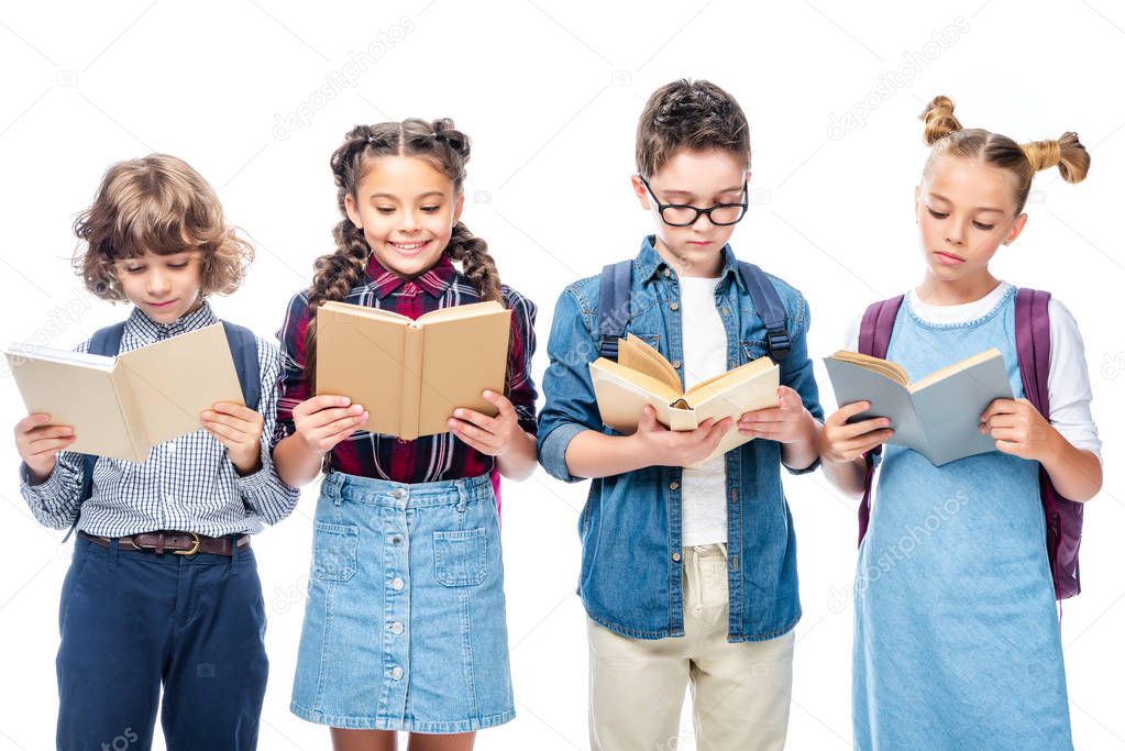 schoolchildren standing and reading books isolated on white