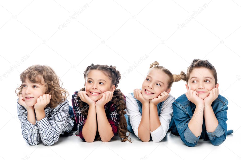 classmates resting chins on hands and looking away isolated on white