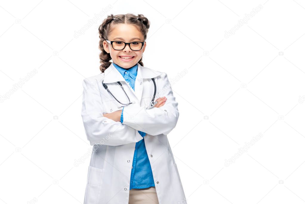 happy schoolchild in white coat standing with crossed arms isolated on white