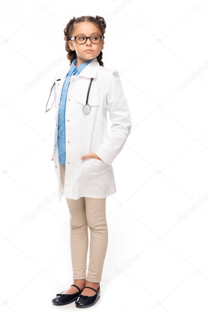 schoolchild in white coat looking away isolated on white