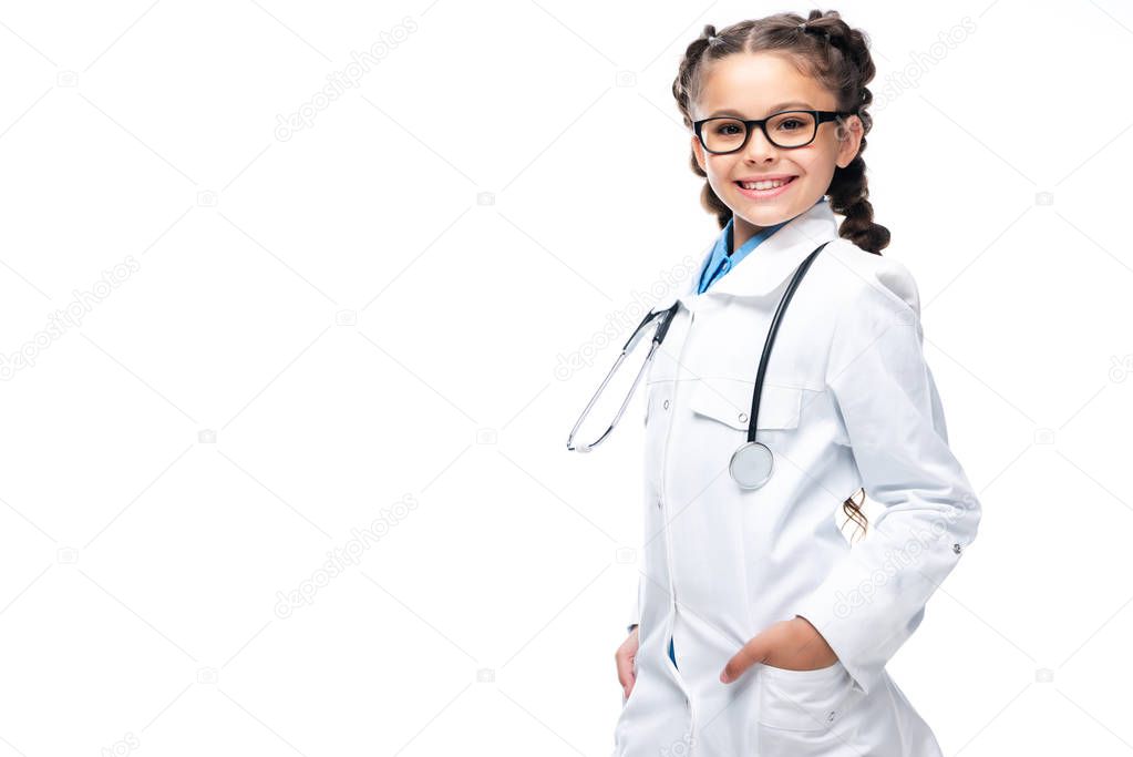 smiling schoolchild in white coat looking at camera isolated on white