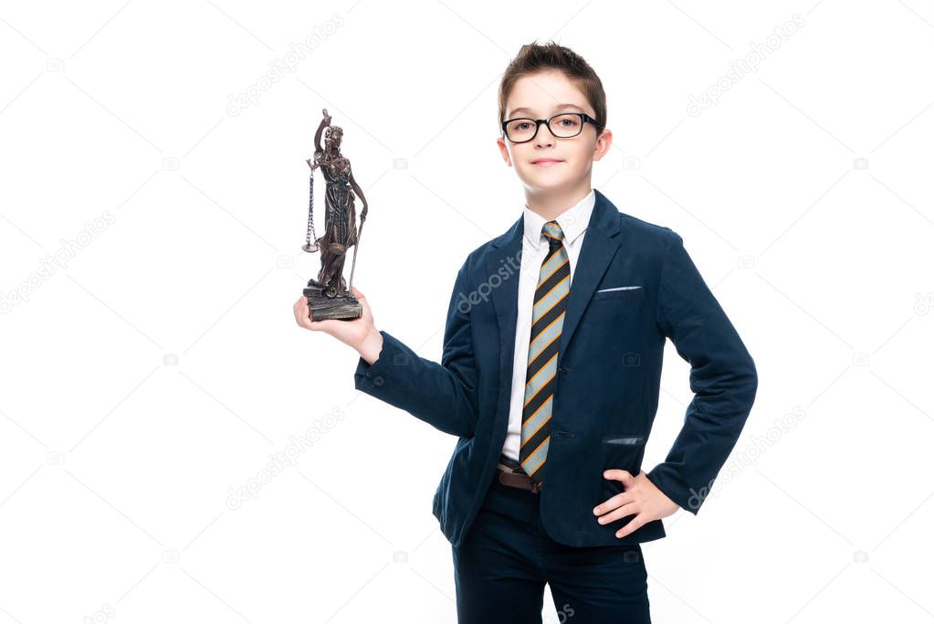 schoolboy in costume of lawyer posing with themis statue isolated on white