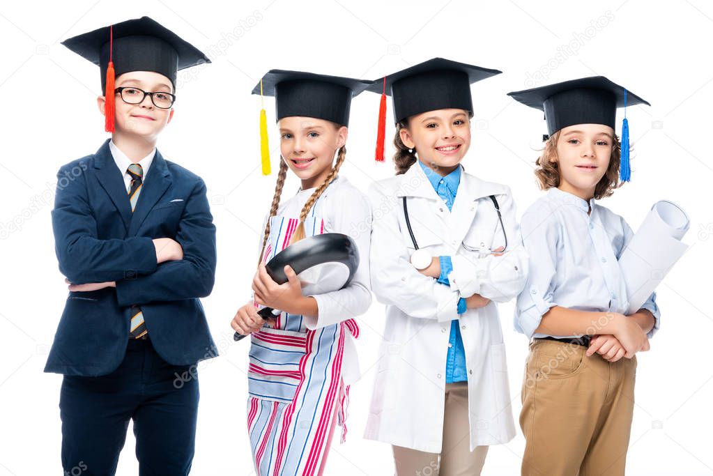 schoolchildren in costumes of different professions and graduation caps isolated on white