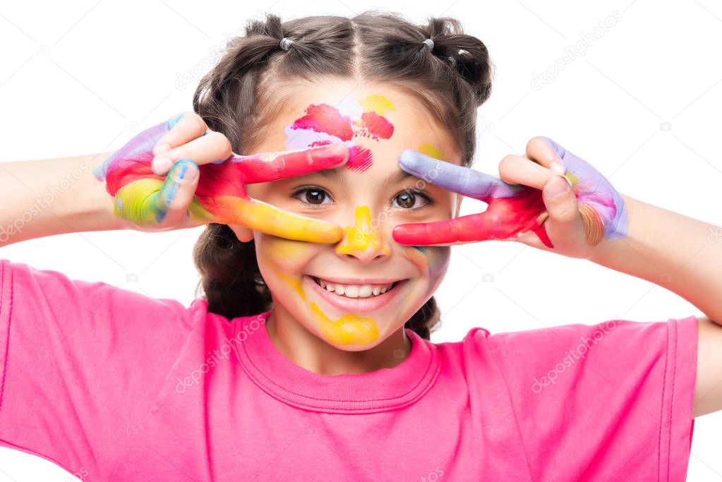 schoolchild having fun with painted hands isolated on white