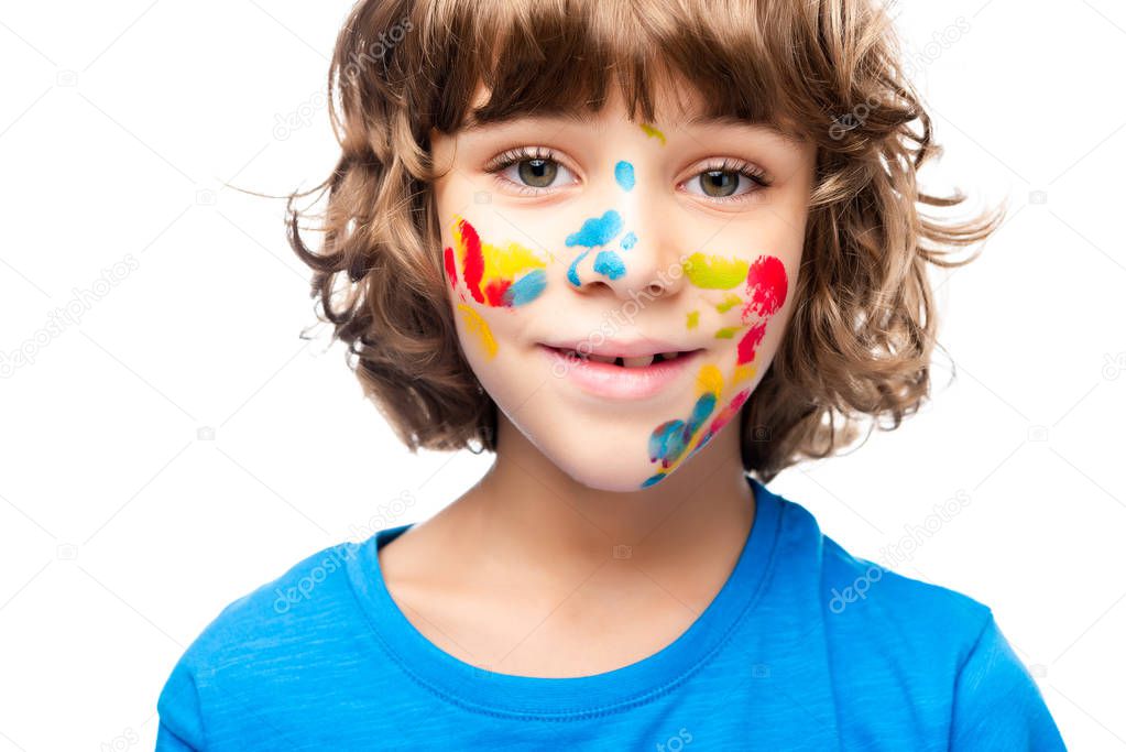 portrait of adorable schoolboy looking at camera isolated on white