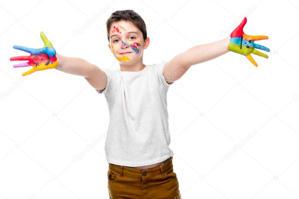 schoolboy showing painted hands with smiley icons isolated on white