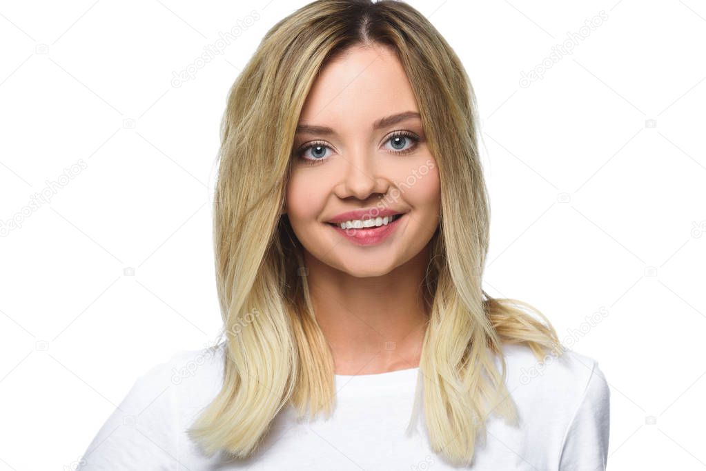portrait of cheerful attractive girl in white shirt looking at camera isolated on white