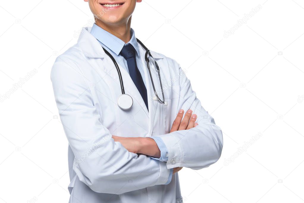 cropped shot of smiling young doctor with crossed arms isolated on white