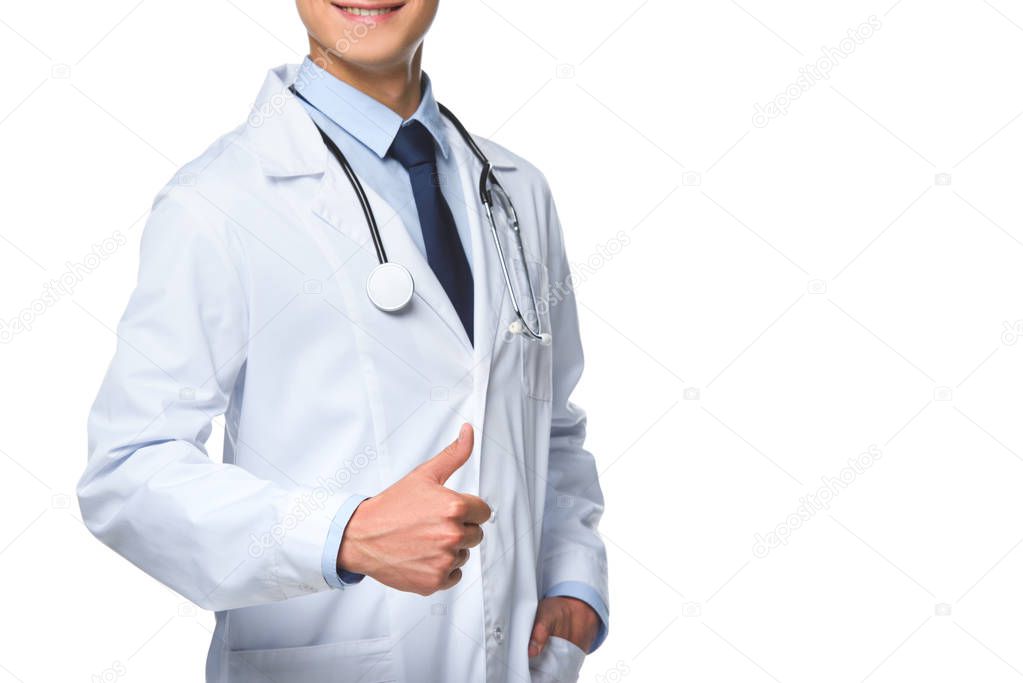 cropped shot of young doctor showing thumb up isolated on white