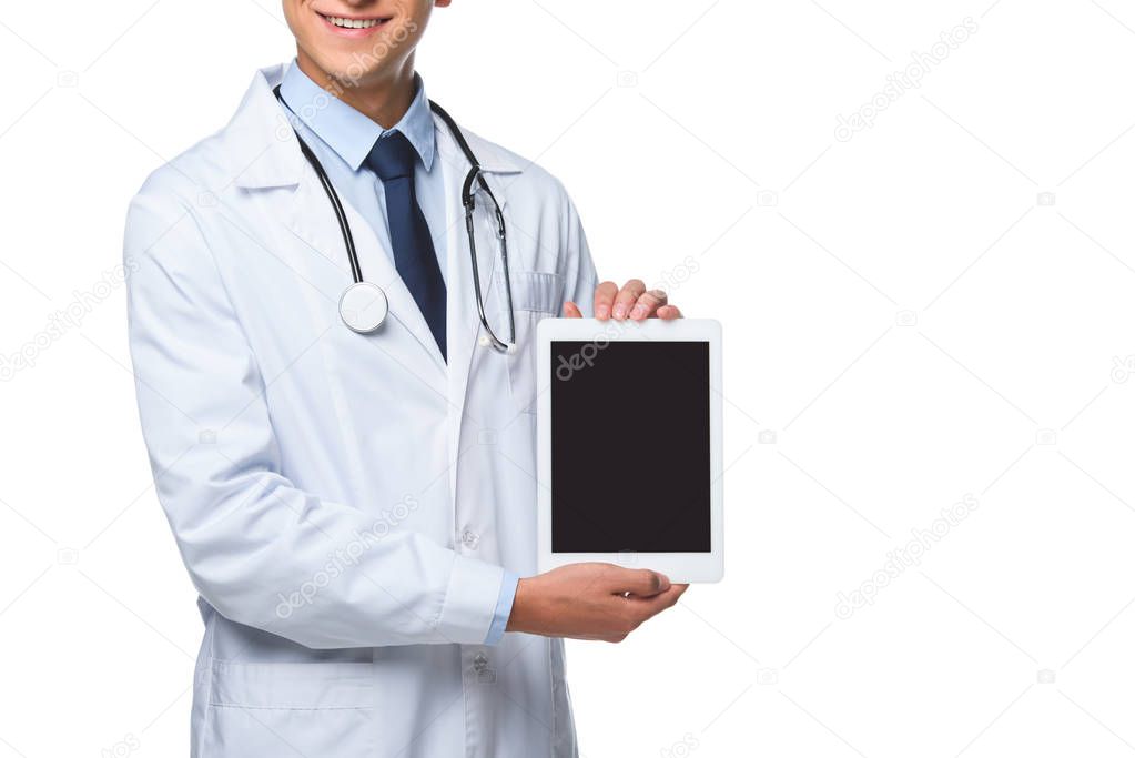 cropped shot of young doctor holding tablet with blank screen isolated on white