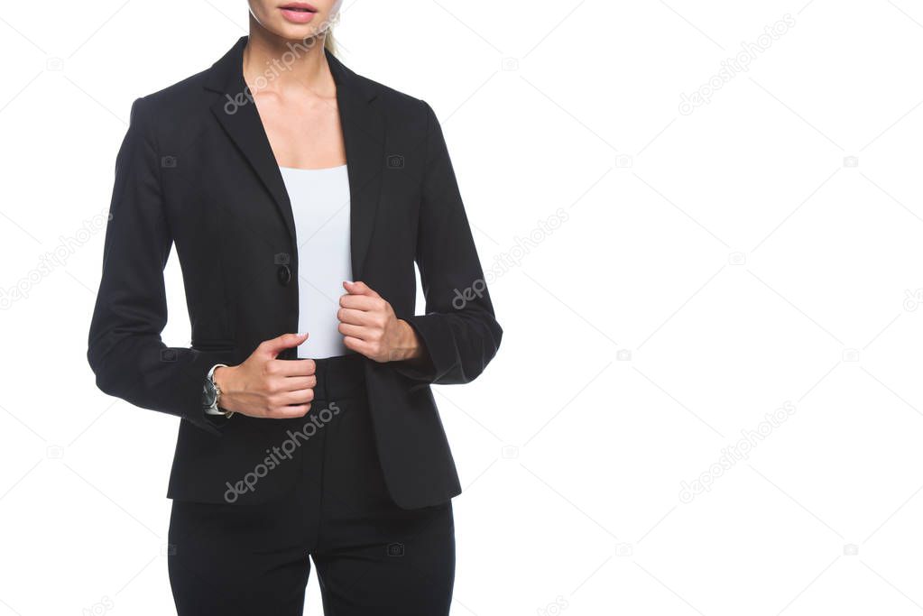 cropped shot of young businesswoman in stylish black suit isolated on white