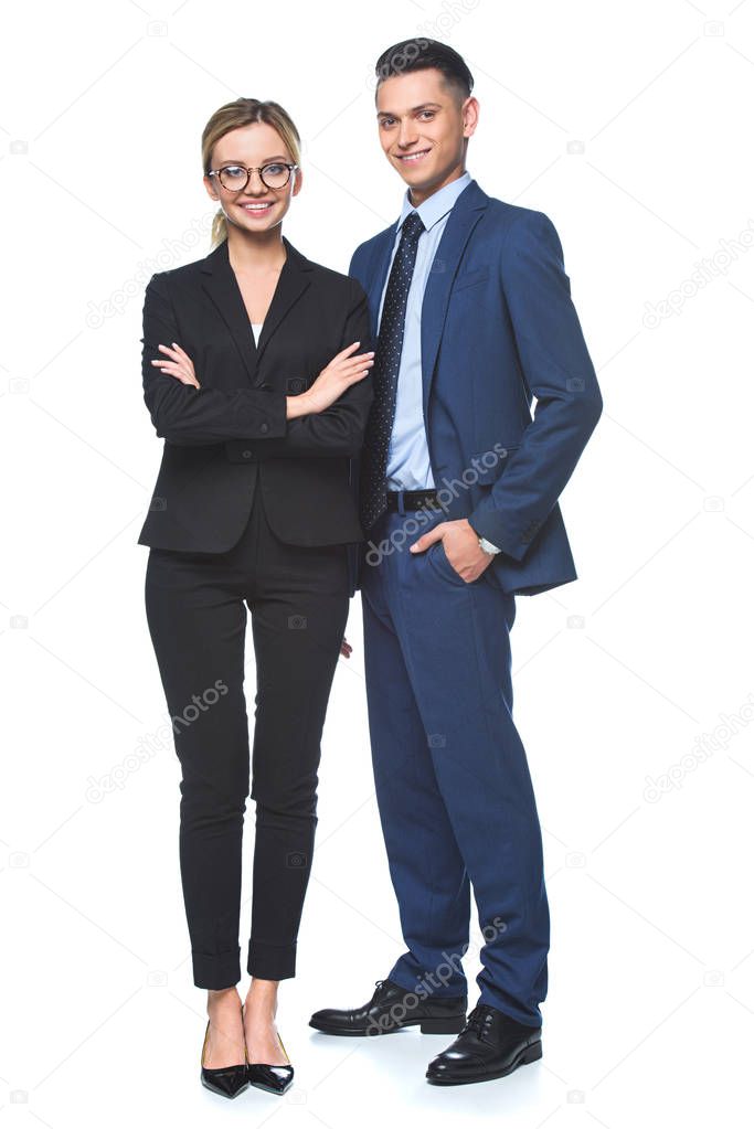 happy business partners in suits looking at camera isolated on white
