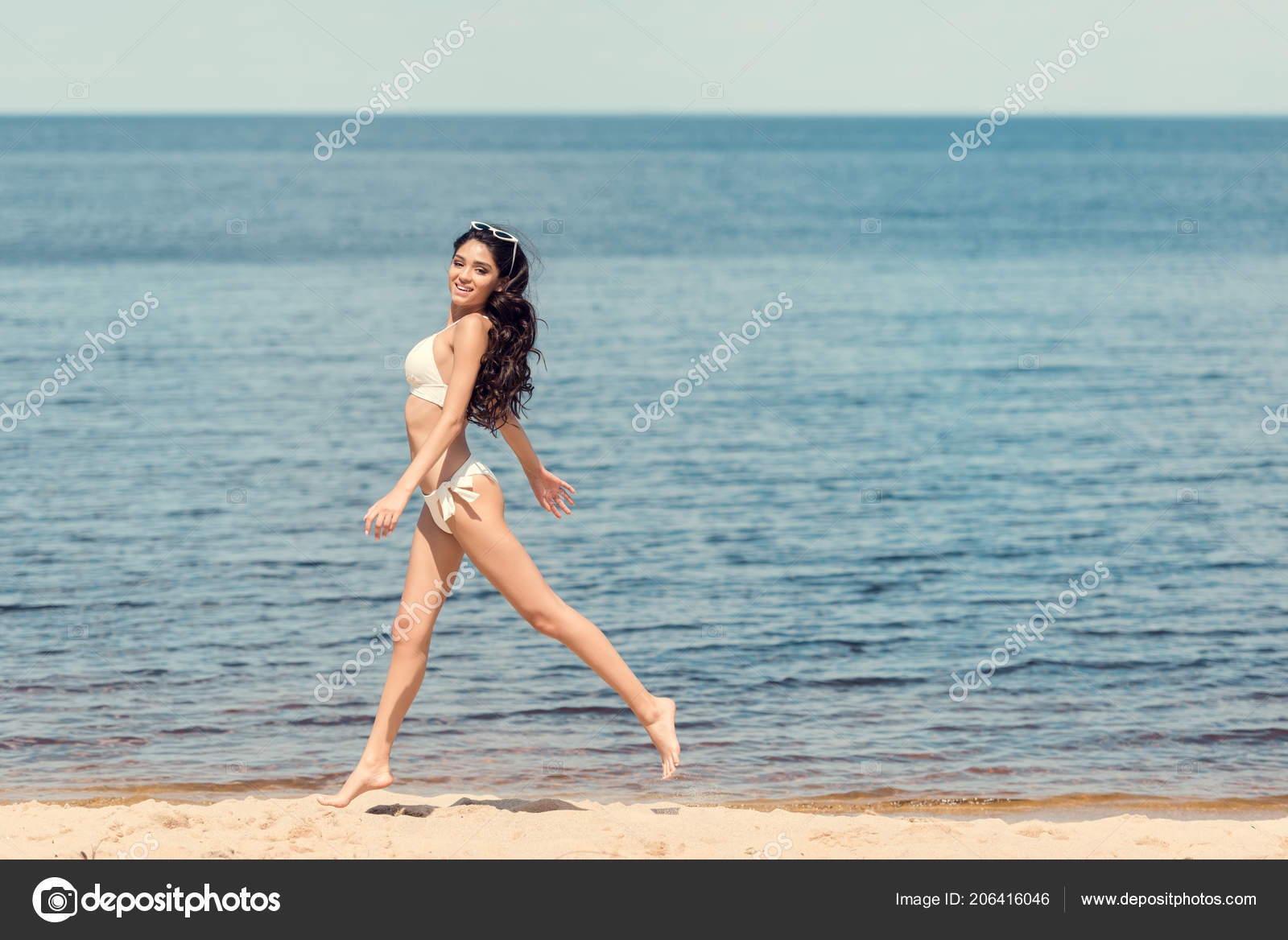 Happy Slim Young Woman White Bikini Jumping Sea Beach Stock Photo by  Â©AllaSerebrina 206416046