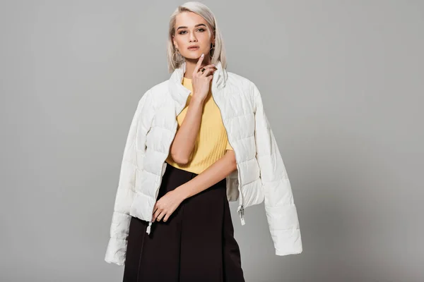 Confident Young Female Model White Jacket Shoulders Posing Isolated Grey — Stock Photo, Image