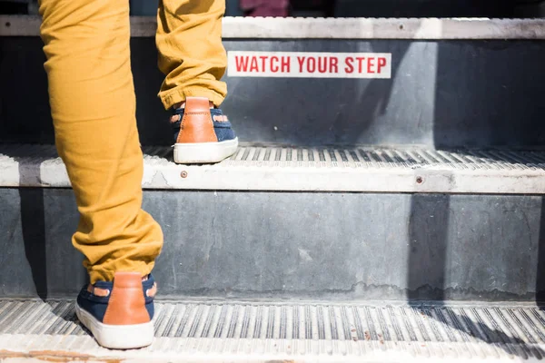 Cropped Shot Child Going Upstairs Bus Watch Your Step Sign — Stock Photo, Image