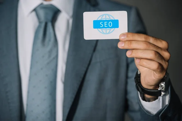 Partial View Successful Developer Showing Card Seo Sign — Free Stock Photo