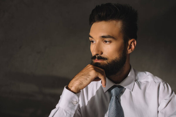 portrait of bearded pensive professional businessman 