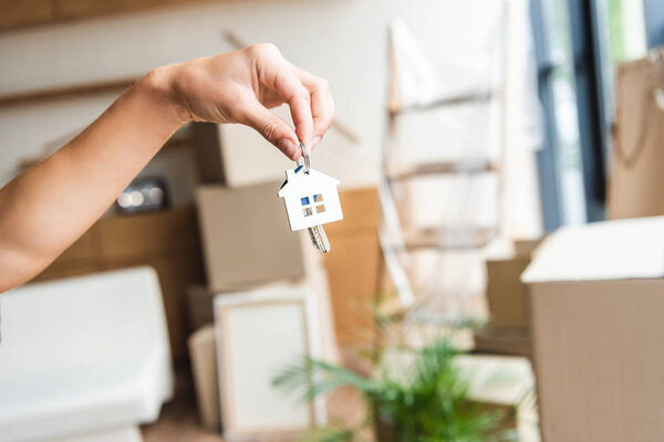 cropped shot of owner holding keys from new house