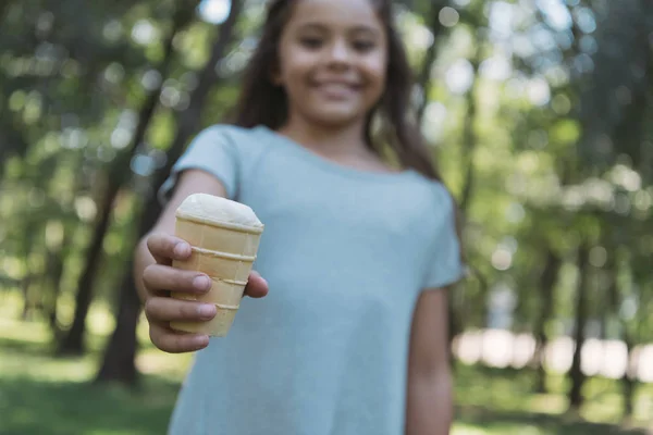 Selective Focus Adorable Child Holding Ice Cream Smiling Camera Park — Stock Photo, Image