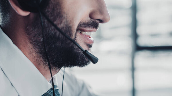 cropped shot of happy support hotline worker in white shirt at work