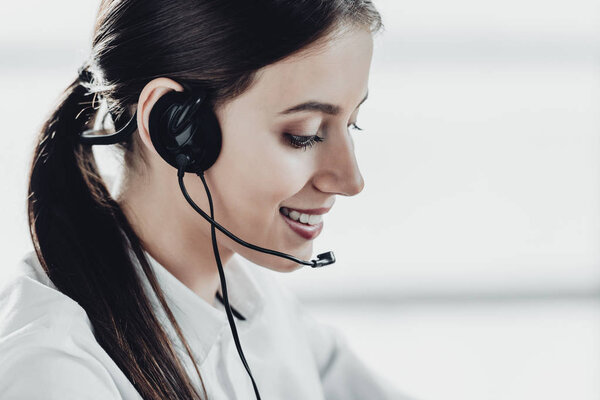 beautiful female call center worker with headphones