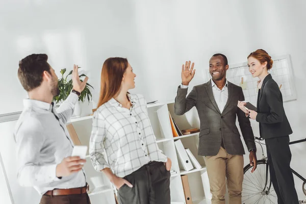 Smiling Multicultural Businesspeople Waving Hands Office — Stock Photo, Image