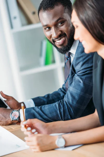 Smiling African American Businessman Holding Tablet Looking Colleague Office — Free Stock Photo