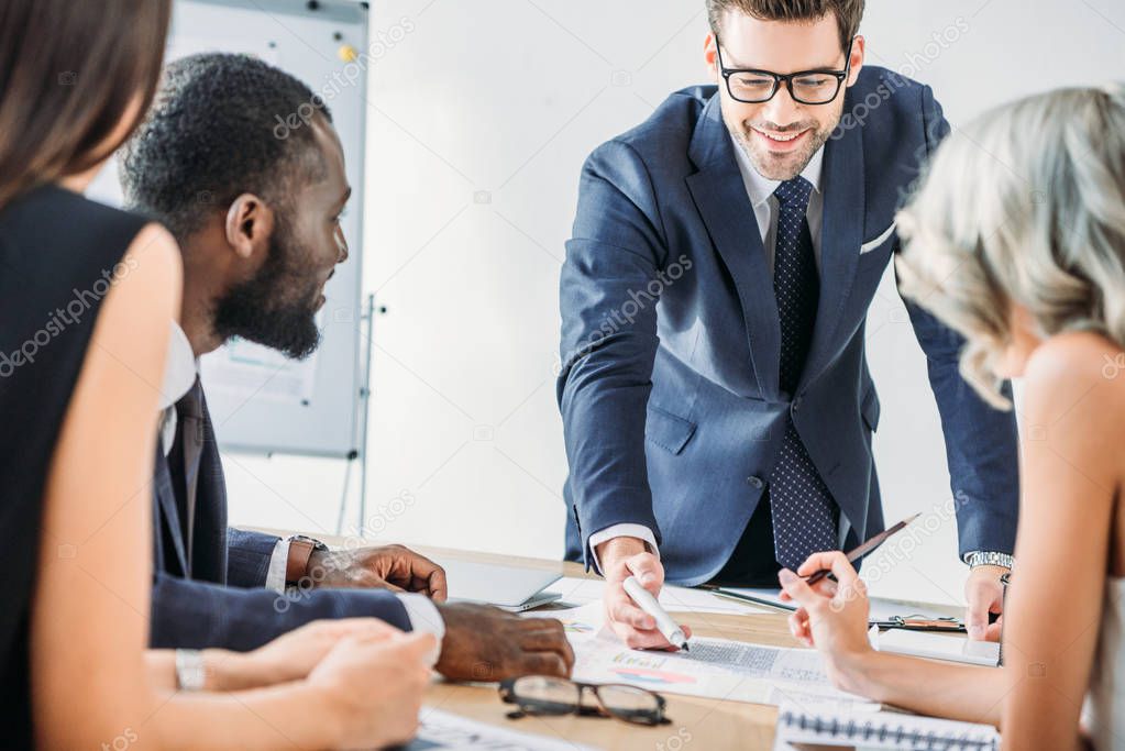 young multicultural businesspeople during meeting in office