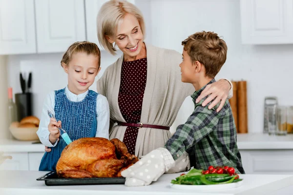 Happy Siblings Preparing Thanksgiving Turkey Grandmother Kitchen — Stock Photo, Image