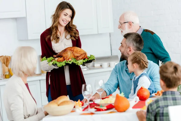 Happy Woman Carrying Baked Turkey Thanksgiving Dinner Family — Stock Photo, Image