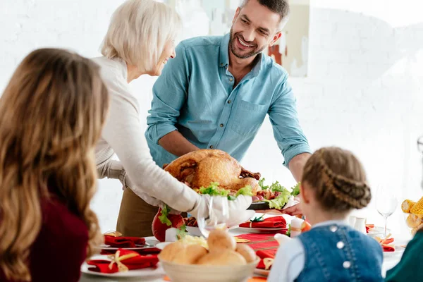 Grandmother Carrying Delicious Baked Turkey Thanksgiving Dinner Family — Stock Photo, Image
