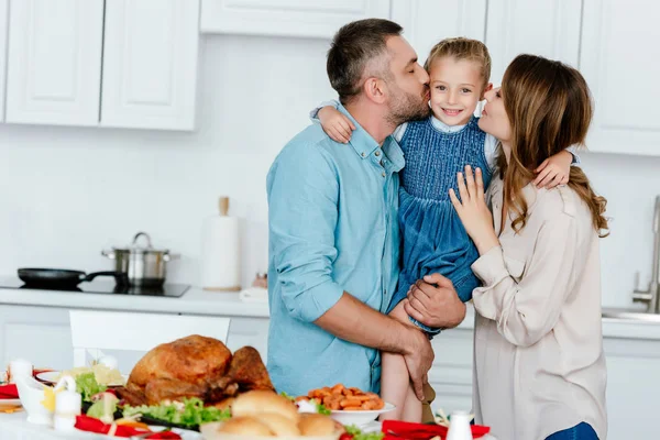 Adult Man Woman Kissing Little Daughter Served Table Thanksgiving Celebration — Stock Photo, Image