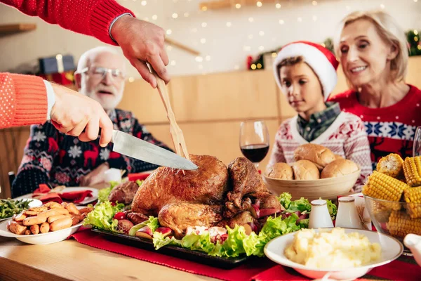 Partial View Man Slicing Holiday Turkey Christmas Celebration Happy Family — Stock Photo, Image